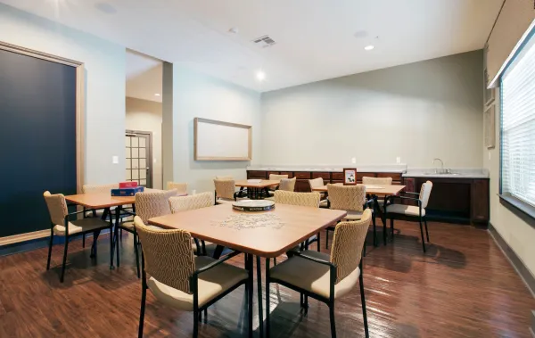 The arts and crafts room, with tables and a sink for projects and classes