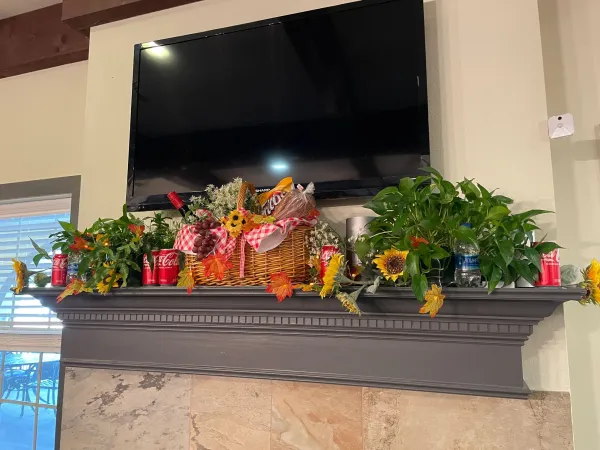 A fireplace mantel decorated for the season