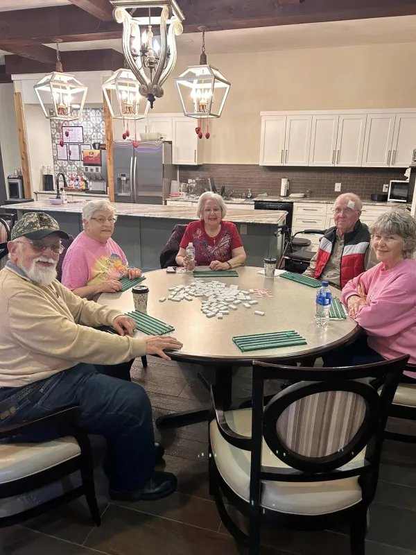 A lively resident game night around the table