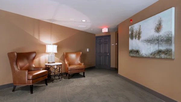 A cozy sitting nook tucked along a residential hallway