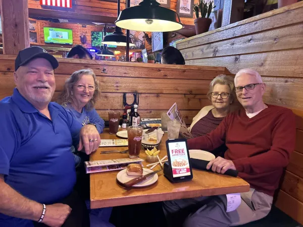 Residents enjoying a group lunch outing